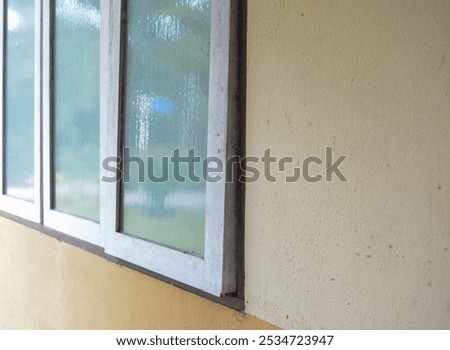 The image suggests that the window frame may need to be repaired or replaced to improve the building's energy efficiency and structural integrity.