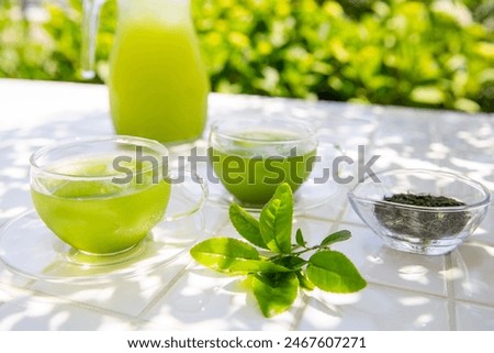 Image of summer green tea, cold tea enjoyed in the shade of a tree