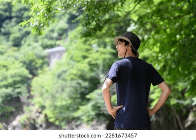 Image of summer leisure Close-up of a man in fresh greenery