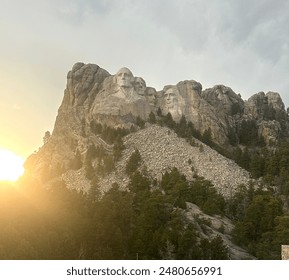 Image of the sun setting by Mount Rushmore
