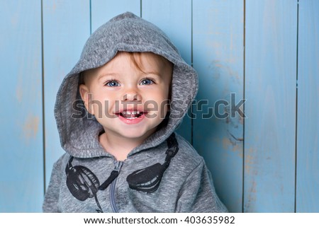 Image of  sweet baby boy, closeup portrait of child, cute toddler with blue eyes