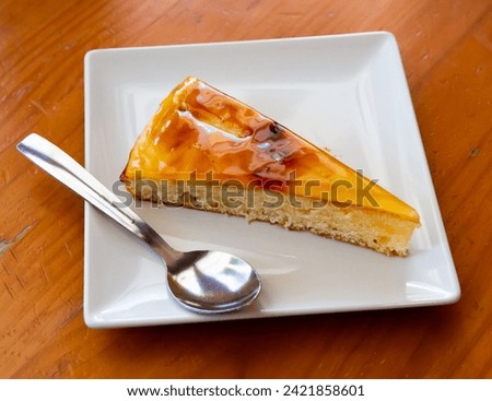 Image of sweet Catalan cream pie dessert with caramel crust served at plate