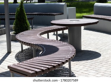 Image of tables and chairs in a summer park.Recreation area in the city park.