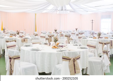 An Image Of Tables Setting At A Luxury Wedding Hall