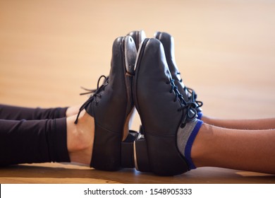Image of tap shoes from a tap dance class in a dance studio.