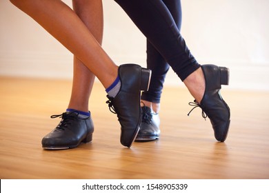 Image of tap shoes from a tap dance class in a dance studio. - Powered by Shutterstock