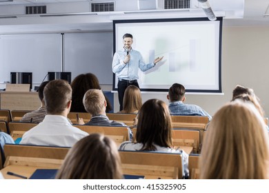 Image of a teacher giving a lecture to his students