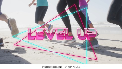 Image of text level up, in metallic pink, with legs of women running on beach. social media, fitness, wellbeing and communication network concept, digitally generated image. - Powered by Shutterstock