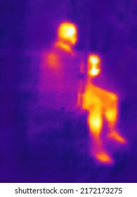 The image from thermal imager device. Human heat map. Blurred unrecognizable people. - Shutterstock ID 2172173275