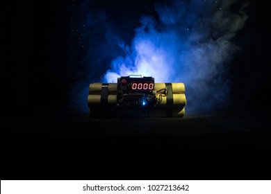 Image Of A Time Bomb Against Dark Background. Timer Counting Down To Detonation Illuminated In A Shaft Light Shining Through The Darkness, Conceptual Image