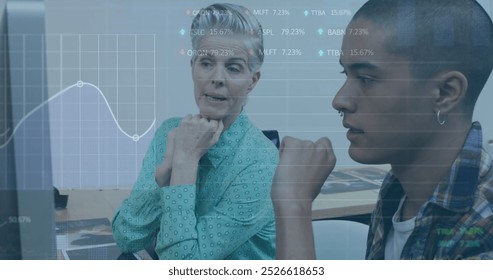 Image of trading board, graph over diverse coworkers discussing reports over computer in office. Digital composite, multiple exposure, stock market, business, teamwork and technology concept. - Powered by Shutterstock