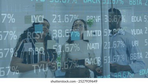 Image of trading board, infographic interface, diverse coworkers sharing ideas on digital tablet. Digital composite, multiple exposure, stock market, business, teamwork, communication, technology. - Powered by Shutterstock