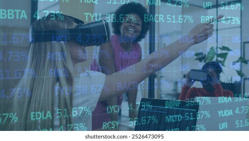 Image of trading board over diverse female coworkers testing vr headsets in office. Digital composite, multiple exposure, stock market, investment, metaverse, teamwork and technology concept. - Powered by Shutterstock