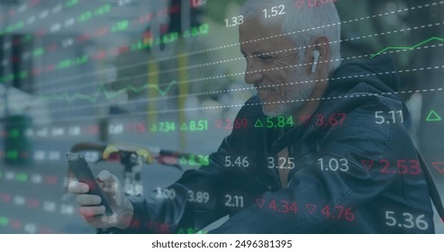 Image of trading board over senior caucasian man listening to music wearing wireless headphones. Digital composite, multiple exposure, business, stock market, retirement and technology concept. - Powered by Shutterstock