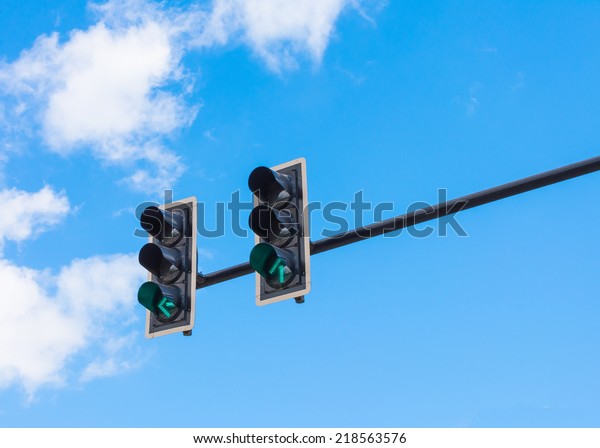 image of traffic light, the green light is lit.\
symbolic  for going.
