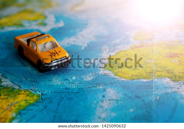 Image of travel\
concept. small car on world map. Abstract idea of rent a car.\
Travel and transport concept.\
dream