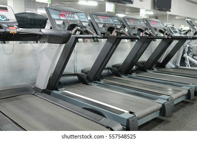 image of treadmills in a fitness hall - Shutterstock ID 557548525