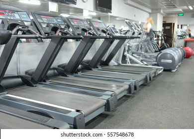image of treadmills in a fitness hall - Shutterstock ID 557548678