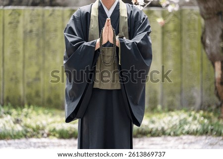 An image of a tree funeral held by a monk