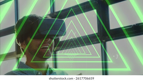 Image of tunnel with neon shapes over biracial man using vr headset. global technology, social media and digital interface concept digitally generated image. - Powered by Shutterstock - Get 15% off with code: PIKWIZARD15