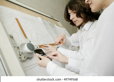 An image of two architects working together