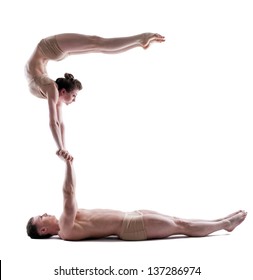 Image Of Two Young Acrobats Balancing In Studio