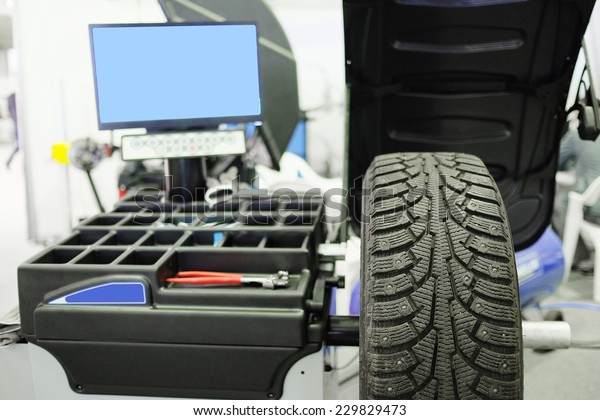 image\
of tyre fitting machine under the white\
background