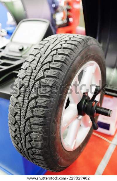 image\
of tyre fitting machine under the white\
background