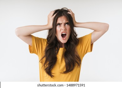 Image of unhappy resentful woman wearing casual t-shirt grabbing head in irritation isolated over white background