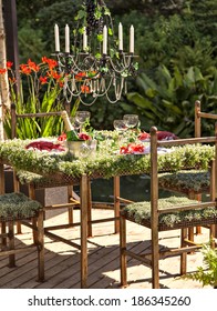 Image Of An Unusual And Picturesque Garden Table Setting.