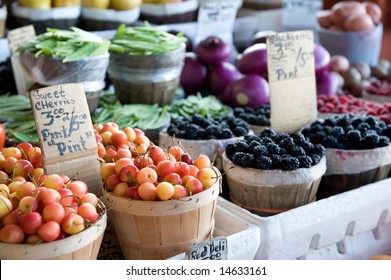 An image of a variety of fruits and vegetables at an outdoor farmer's market - Powered by Shutterstock