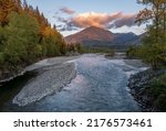 Image of the Vedder river also known as the Chilliwack river in beautiful evening light taken from the Vedder bridge in Chilliwack British Columbia Canada