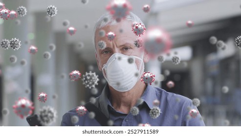 Image of virus cells over senior caucasian man wearing face mask. Global medicine and healthcare concept digitally generated image. - Powered by Shutterstock