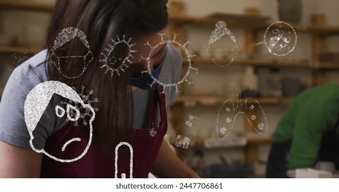 Image of virus icons over caucasian woman with face mask forming pottery. hobby during covid 19 pandemic concept digitally generated image. - Powered by Shutterstock