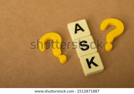 The image visually represents the act of asking questions, with the letters "ASK" and question marks arranged together.