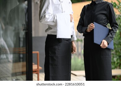 Image of a waiter in the service and hospitality industry and restaurant industry no face - Powered by Shutterstock