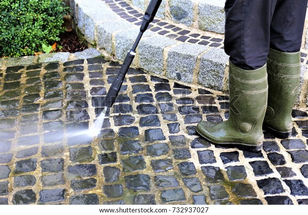 An\
Image of walkway cleaning - high pressure\
cleaner