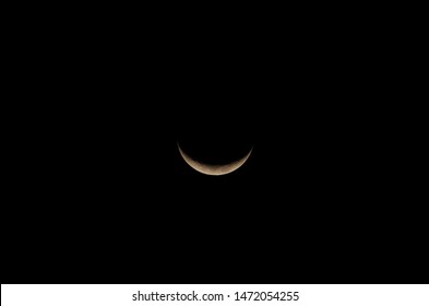 An image of the waning moon with black sky at night
