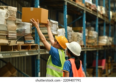 Image Of Warehouse Workers Checking Inventory And Quantity Of Storage Product On Shelf Full Of Packed Boxes And Goods