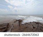 An image of waves making patterns at one of the beaches in Vizag, i.e., Bheemili Beach, which is part of the coastline of the Bay of Bengal in the state of Andhra Pradesh in India.