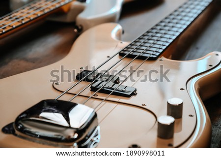 image of white Electric bass guitar closeup