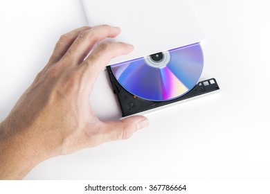 Image of white external cd dvd burner reader isolated on white with hand
