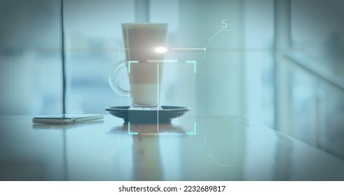 Image of a white QR code scanning over a cup of caffe latte standing on a table in a cafe. Digital composite image