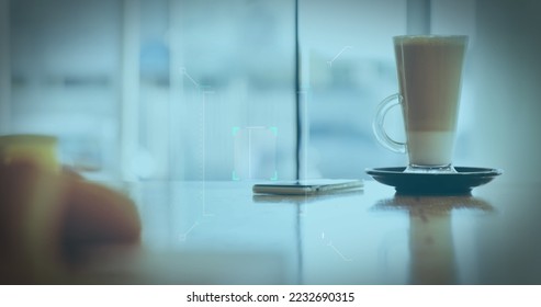 Image of a white QR code scanning over a cup of caffe latte standing on a table in a cafe. Digital composite image