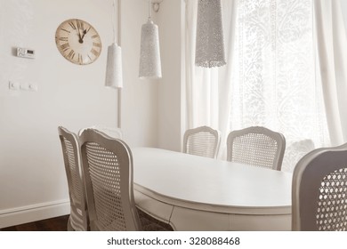 Image of white table and chairs in dining room