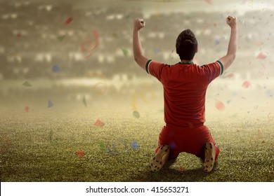 Image of winning football player after score in a match - Powered by Shutterstock