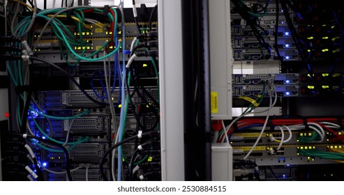 Image of wires and servers in server room. global digital interface, data processing and technology concept digitally generated image.