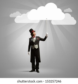 Image of wizard in hat catching clouds