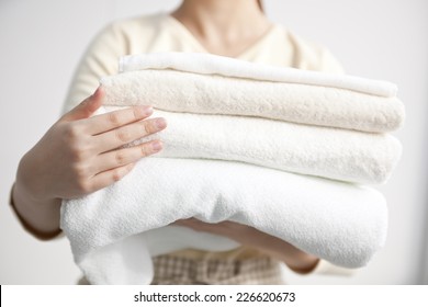 Image Of A Woman Holding A Towel