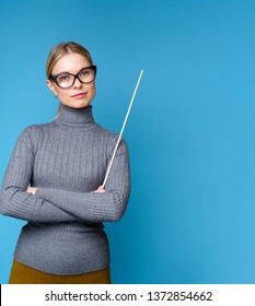 Image Of Woman Teacher In Glasses With Pointer.